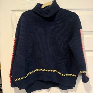 SJYP Blue Turtleneck Sweater with Yellow and Red Accents